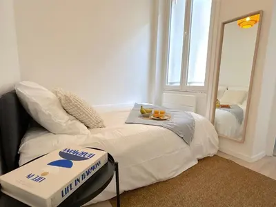 Un ou plusieurs lits dans un hébergement de l'établissement L'appartement Plaisance