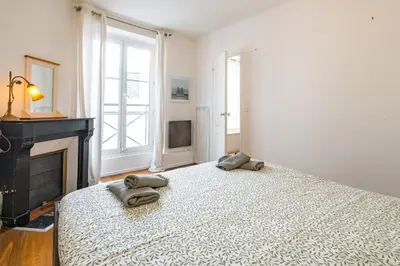 Un ou plusieurs lits dans un hébergement de l'établissement 6 Guests Flat - Jardin des Plantes