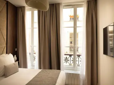 Un ou plusieurs lits dans un hébergement de l'établissement Elegant apartment - 2BR- 6P- Gare Saint Lazare, cleaning included