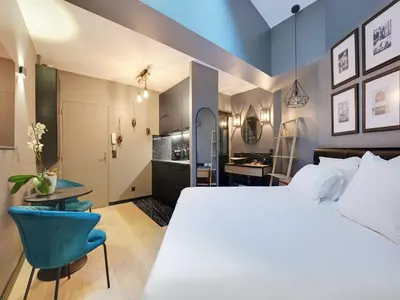 Un ou plusieurs lits dans un hébergement de l'établissement Charming studio -2P- Auteuil, cleaning included