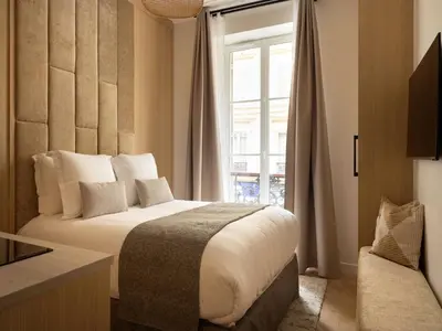 Un ou plusieurs lits dans un hébergement de l'établissement Charming Cosy Studio - 2P - Gare Saint Lazare, cleaning included