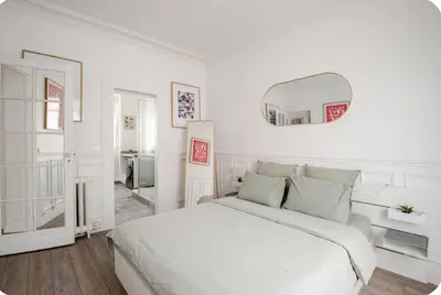 Un ou plusieurs lits dans un hébergement de l'établissement Charmant appartement décoré proche du parc des expositions
