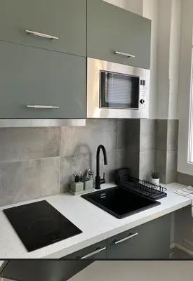 Cuisine ou kitchenette dans l'établissement Charmant appartement décoré proche du parc des expositions