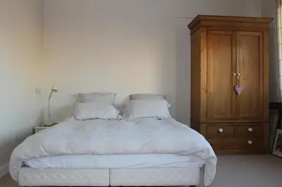 Un ou plusieurs lits dans un hébergement de l'établissement Appartement spacieux aux portes de Paris