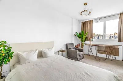 Un ou plusieurs lits dans un hébergement de l'établissement Suite Vue Tour Eiffel