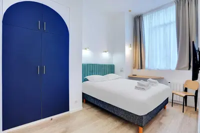 Un ou plusieurs lits dans un hébergement de l'établissement Parisian stay close to Montmartre - 2BR 8P