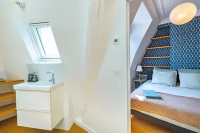 Un ou plusieurs lits dans un hébergement de l'établissement 6 Guest Flat - Martyrs