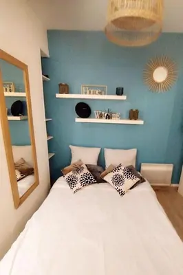 Un ou plusieurs lits dans un hébergement de l'établissement Studio cosy Paris Centre