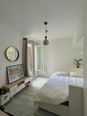 Un ou plusieurs lits dans un hébergement de l'établissement Cozy studio near Paris