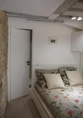 Un ou plusieurs lits dans un hébergement de l'établissement Studio jardin privé paris centre