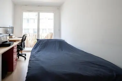 Un ou plusieurs lits dans un hébergement de l'établissement Thionville 2 - KP - Bright apartment for 4 people Paris 19