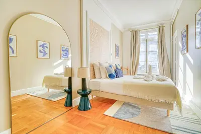 Un ou plusieurs lits dans un hébergement de l'établissement Charme et standing - 2 chambres proches Trocadéro