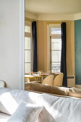 Un ou plusieurs lits dans un hébergement de l'établissement Charme et standing - 2 chambres proches Trocadéro