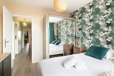 Un ou plusieurs lits dans un hébergement de l'établissement Gorgeous apartment Near Paris - 5P