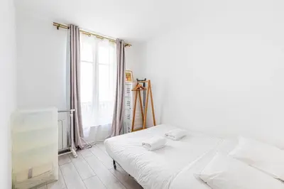 Un ou plusieurs lits dans un hébergement de l'établissement GuestReady - Serene base two steps from Paris