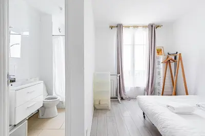 Un ou plusieurs lits dans un hébergement de l'établissement GuestReady - Serene base two steps from Paris