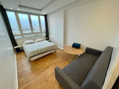 Un ou plusieurs lits dans un hébergement de l'établissement Appartement Vicat Porte de Versailles