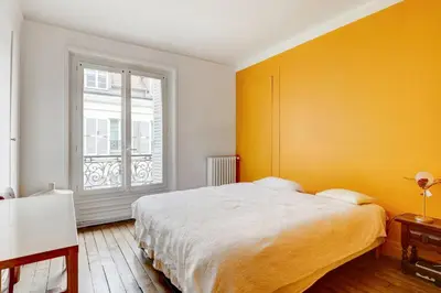 Un ou plusieurs lits dans un hébergement de l'établissement Charmant 70m2 pour 4 pers Rue de Crussol Paris