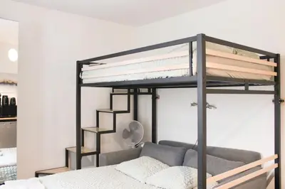 Un ou plusieurs lits dans un hébergement de l'établissement Studio cosy À deux pas de Montmartre