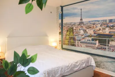 Un ou plusieurs lits dans un hébergement de l'établissement Cosy Studio Cœur de Montparnasse