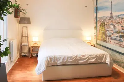 Un ou plusieurs lits dans un hébergement de l'établissement Cosy Studio Cœur de Montparnasse