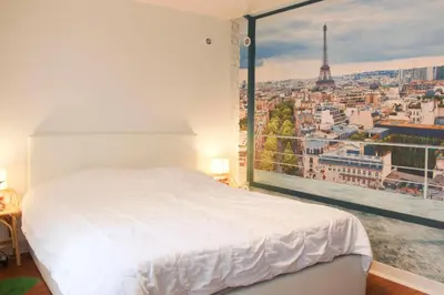 Un ou plusieurs lits dans un hébergement de l'établissement Cosy Studio Cœur de Montparnasse