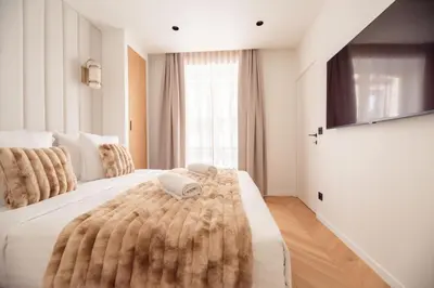 Un ou plusieurs lits dans un hébergement de l'établissement Stylish Flat in Paris' Center