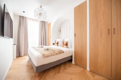 Un ou plusieurs lits dans un hébergement de l'établissement Stylish Flat in Paris' Center