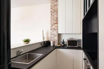 Cuisine ou kitchenette dans l'établissement Elegant Flat - 6 Guests - Saint Germain des Prés