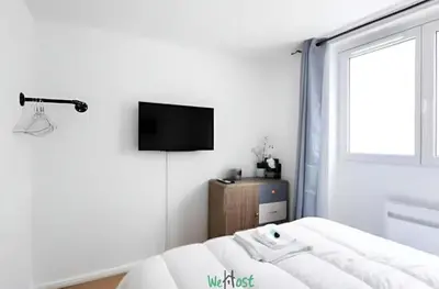 Télévision ou salle de divertissement dans l'établissement Charminng & cosy T2 for two in Paris 13th