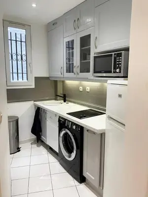 Cuisine ou kitchenette dans l'établissement Appartement 75017 proche Parc Monceau