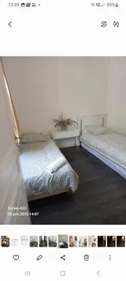 Un ou plusieurs lits dans un hébergement de l'établissement Fastrentbnb Appartement complet Paris Crimee