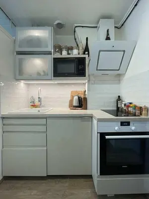 Cuisine ou kitchenette dans l'établissement Fastrentbnb Appartement complet Paris Crimee