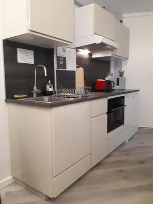 Cuisine ou kitchenette dans l'établissement Cozy new studio central close Eiffel tower