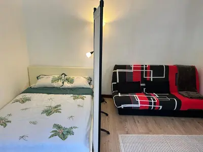 Un ou plusieurs lits dans un hébergement de l'établissement Studio 22m2 rénové sur cour privée