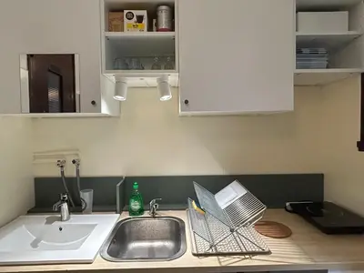 Cuisine ou kitchenette dans l'établissement Studio 22m2 rénové sur cour privée