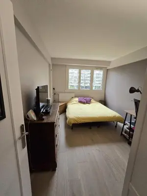 Un ou plusieurs lits dans un hébergement de l'établissement Chambre d'hôtes Paris La défense Arena