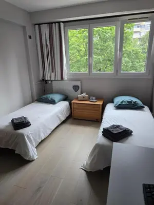 Un ou plusieurs lits dans un hébergement de l'établissement Chambre d'hôtes Paris La défense Arena
