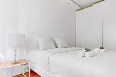 Un ou plusieurs lits dans un hébergement de l'établissement Appartement chic 82m2 6 pers Paris 16E