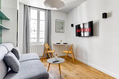 Coin salon dans l'établissement BM Rue Charlot Studio compact & chic pour 2