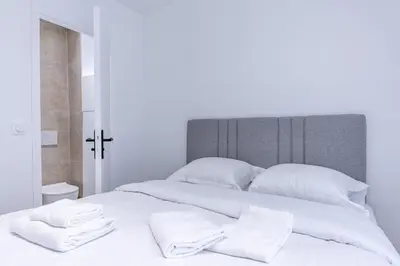 Un ou plusieurs lits dans un hébergement de l'établissement Chic 4-Star Studio Only 10 Minutes from Le Marais