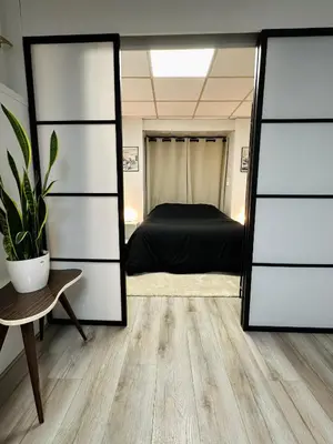 Un ou plusieurs lits dans un hébergement de l'établissement Cosy duplex à Issy-les-Moulineaux