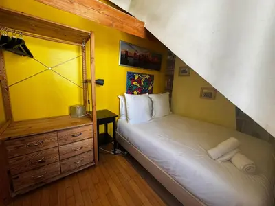 Un ou plusieurs lits dans un hébergement de l'établissement Appartement lumineux au cœur de Montmartre