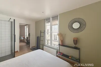 Un ou plusieurs lits dans un hébergement de l'établissement Sunny 1-Bed in Paris Marais District