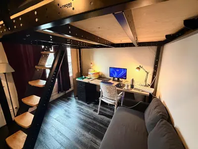Télévision ou salle de divertissement dans l'établissement Studio BASTILLE
