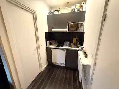 Cuisine ou kitchenette dans l'établissement Studio BASTILLE