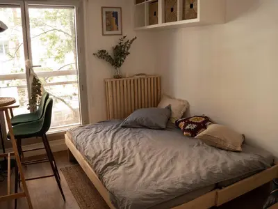 Un ou plusieurs lits dans un hébergement de l'établissement Appartement cosy à deux pas de la Cité Universitaire, accès direct RER B depuis l'aéroport, animaux acceptés
