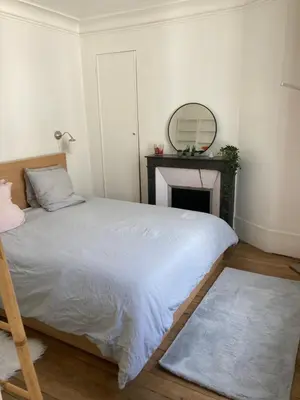 Un ou plusieurs lits dans un hébergement de l'établissement Beau 3 pièces lumineux à 5 min de Montmartre