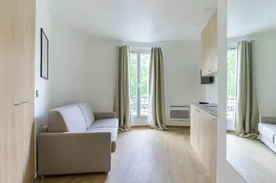 Un ou plusieurs lits dans un hébergement de l'établissement HSH Bessières-Batignolles Paris Superbe Studio