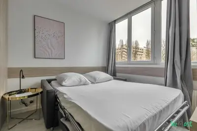 Un ou plusieurs lits dans un hébergement de l'établissement Appartement cosy pour 4 pers. – Parc des Expositions Porte de Versailles